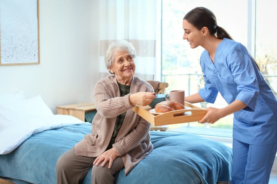 Nurse helping elderly patient